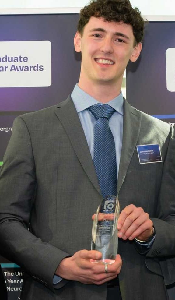 James (Jamie) Mottashed holding his TargetJobs Undergraduate of the Year 2026 award
